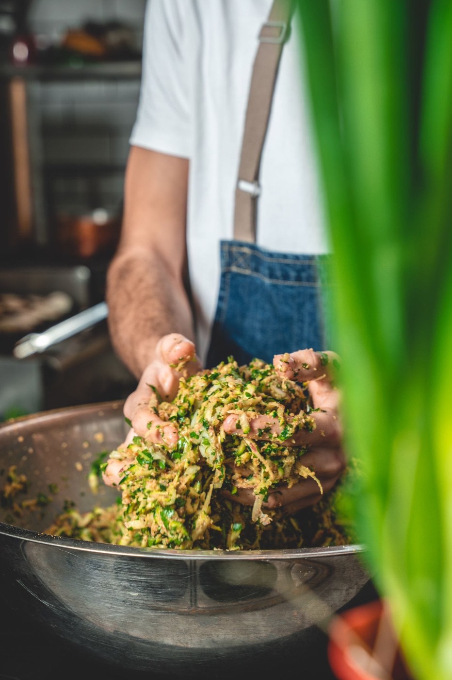 Hands deep in the zucchini mix